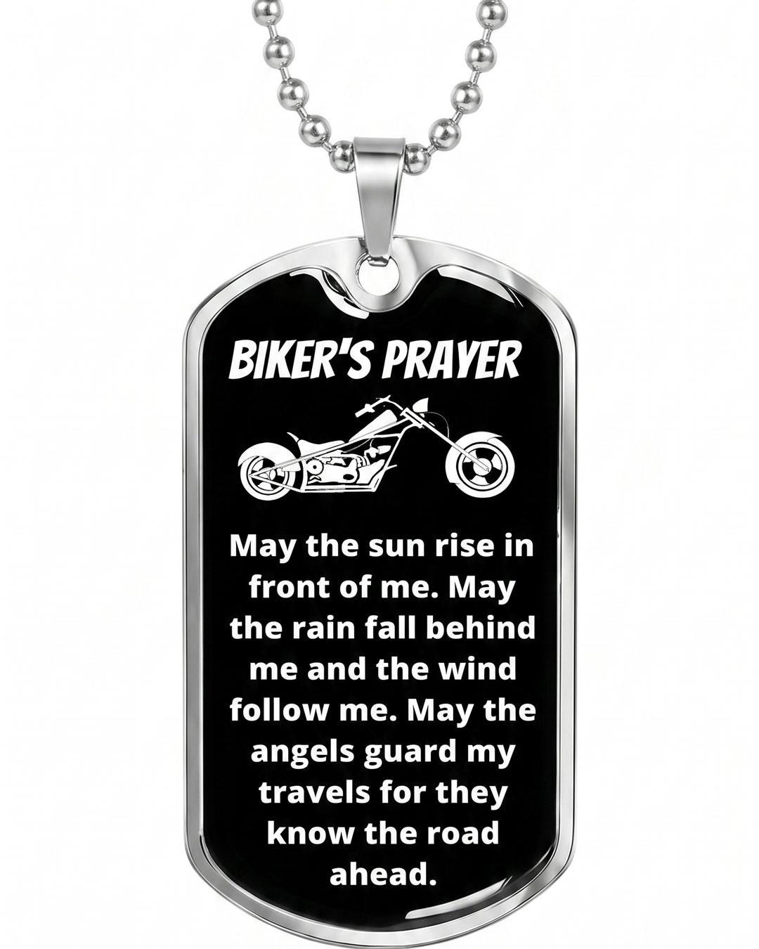 Rider necklace resting on a leather jacket surface showing the full dog tag and ball chain