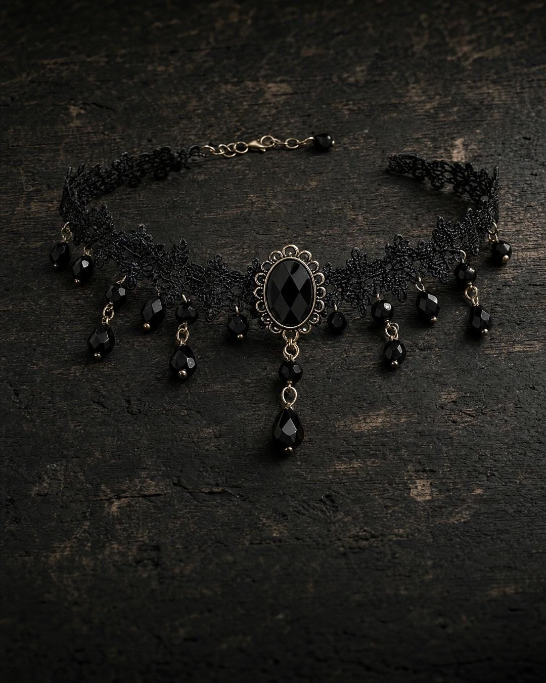 Black lace choker necklace worn close to the throat over a dark outfit with visible bead drops