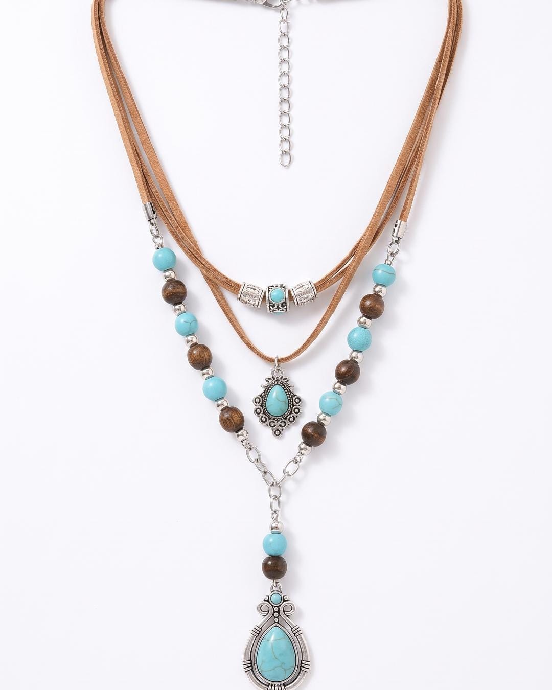 Turquoise and Suede Layered Boho pendant necklace set flat lay, two strands on tan suede