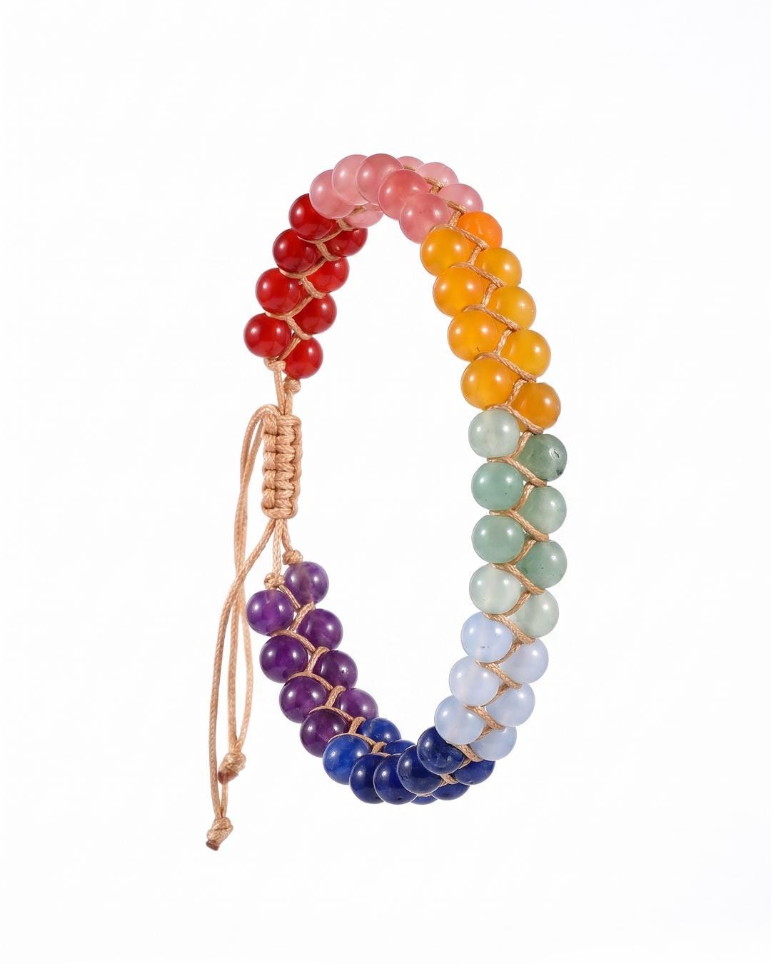 Close flat lay of a rainbow stone double row ankle bracelet showing the full spectrum of polished stones in tan woven cord